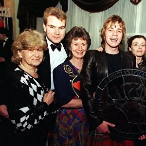 Ewan McGregor with his award and family members. L-R Phyllis Lawson (Gran