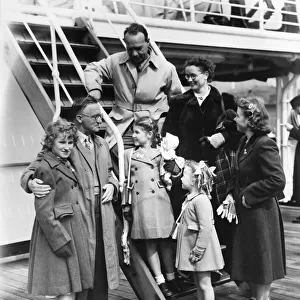 Two families on board the liner Cameronia at Liverpool docks