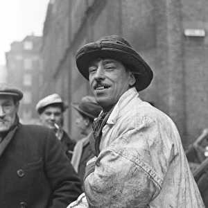 Fish porter wearing his distintive hat at Billingsgate Fish Market in the East End of