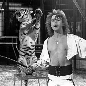 Gary Ambrose of Austen Brothers circus performing with a Bengal tiger, at Preston Park
