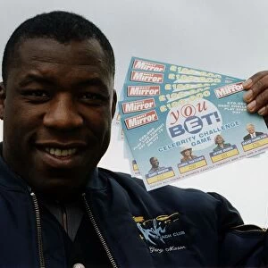Gary Mason Boxing Heavywieght boxer holding up Daily Mirror You Bet game cards