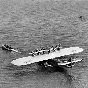 A giant Dormier Do-X seaplane being towed into position before starting on its