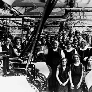 A group of weavers pose for a photograph at India Cotton Mill in Blackbirn, Circa 1930