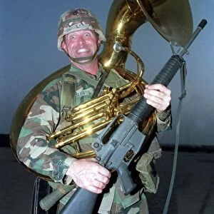 Gulf War Operation Desert Storm. American soldier holding machine gun