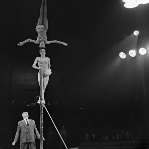Head balancing act in the ring at the Bertram Mills Circus in Cambridge April 1959