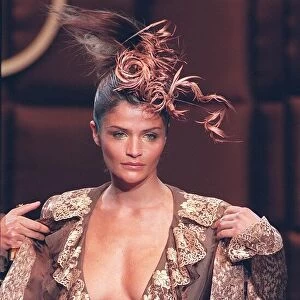 Helena Christensen models for Valentino in Paris Taking odd jacket top with plunging