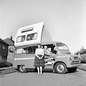 Holidays: Camping. The Astley family seen here getting to grips with their new Dormobile