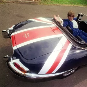 John Dingwall dressed as Austin Powers in E Type Jaguar car September 1999 Union Jack