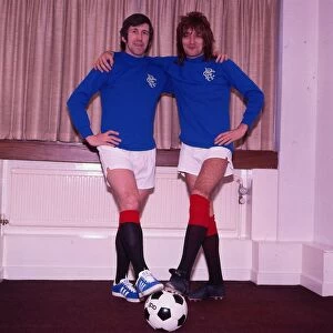 John Greig October 1983 with his arms round singer Rod Stewart both wearing Rangers