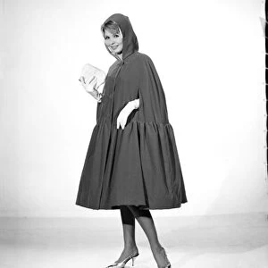 Little Red Riding Hood : Model Elizabeth Duke wearing red velvet cape. 1963