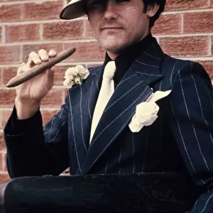 Liverpool star Ray Kennedy smoking a cigar dressed as Chicago gangster Al Capone