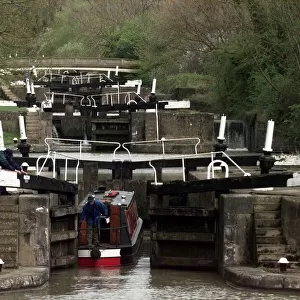 Long Itchington. A barge makes its way through the locks along