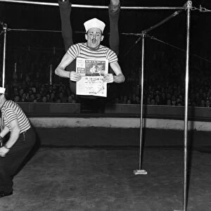 "Merky"the acrobat performing at the Mills Circus. C6334