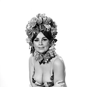 Model wearing a selection of Easter Bonnets. 1966