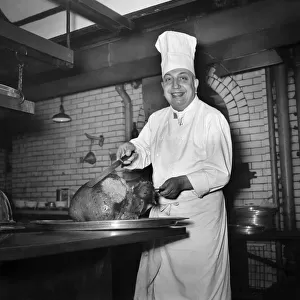 Monsieur Alban, lead chef at Savoy Hotel, with turkey. December 1949 O21983