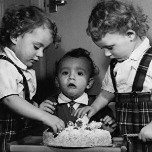 Mum bought them a birthday cake - and the two year old Leese triplets got to grips with