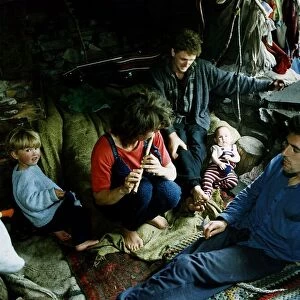 New Age Travellers Deb Sorril and Allan Lane with their children in a makeshift shelter