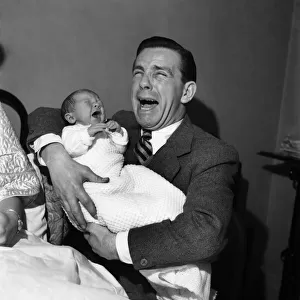 Norman Wisdom with baby son Nicholas. March 1953 D1491-001