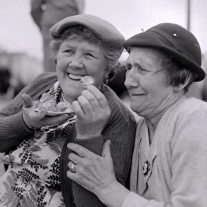 The old folks go young for a day. Gertie Food and Florrie White share a plate of whelks