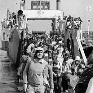 Pop fans leaving the ferry on arrival at The Isle of Wight. 28th August 1970