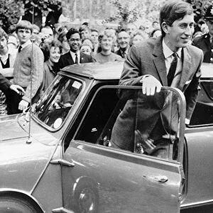 Prince Charles and Mini car arriving at Trinity College in 1967