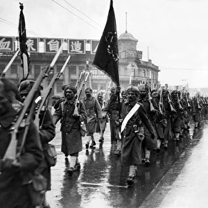 Punjab soldiers of the Shanghai Defence Force marching through the streets of