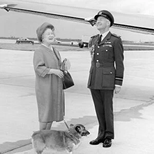 Queen Mother with RAF officer and corgi at Heathrow Airport in May 1983