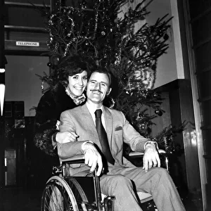 Racing driver Graham Hill left University College Hospital, in a wheelchair