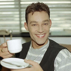 Radio DJ Toby Anstis drinking a cup of tea at The BBC in the Childrens BBC studio