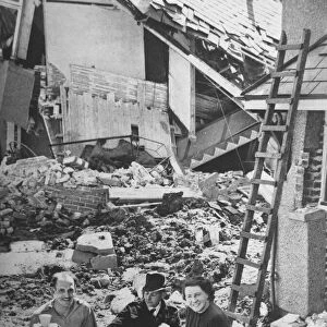 Residents of a bombed out house at Oreston Plymouth have a break from salvaging