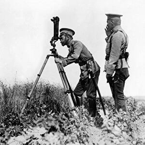 Russian leader Tsar Nicholas II looking through a periscope at the enemy position