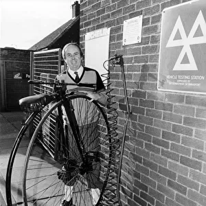 Salesman, John Whitfield, pictured with his 19th Century Penny Farthing Cycle