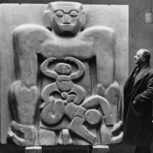 Sculptor Jacob Epstein seen here at the Leicester Square Gallery with his piece Primeval