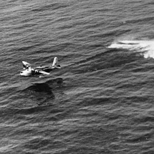 A Short Sunderland of No. 10 Squadron takes off from the water after alighting to rescue