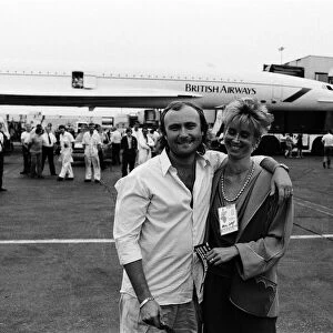 Singer Phil Collins & wife Jill Travelman at London Heathrow Airport 13th July 1985