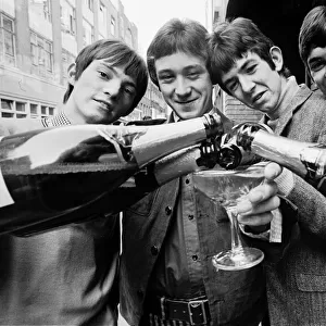 The Small Faces go to the Top of the Pops chart. OPS Celebrating with champagne L-R Steve