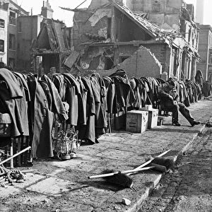Soldiers discarded tunics and coats as they help with the clean up of Chelsea following