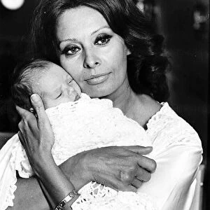 Sophia Loren actress holding baby to recreate the birth of her first child Carlo for a