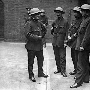 Steel helmets for the London special constables. "Do you find them heavy