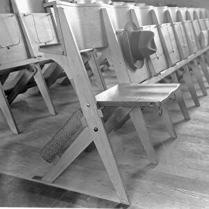 Tip up seats and hat racks at St Jamess Church New Malden. October 1933