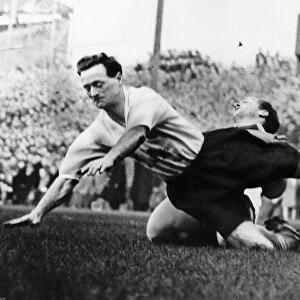 Tom Finney brought to the ground while playing for Preston North End October 1958