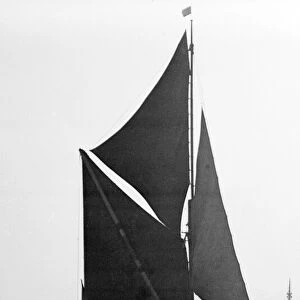 A traditional Thames barge seen here in the Lower Thames estuary circa 1935