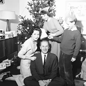 Tv presenter Hughie Green seen here at home at Christmas time with his family