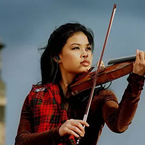 Vanessa Mae at Edinburgh Castle playing violin wearing tartan 1996