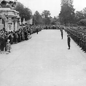 The Welch Regiment presents arms and salutes the city of Cardiff. Circa 1940