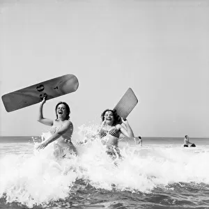 Women body boarding in the surf at Newquay June 1960 M4303-002