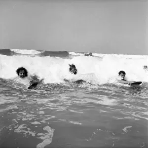 Women body boarding in the surf at Newquay June 1960 M4303