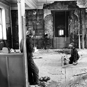 A worker is supervised inside the Queens Hotel section of the old Curzon Street Station