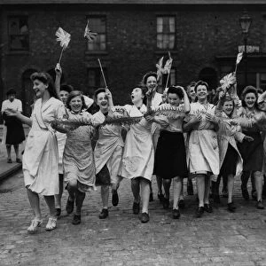 Workers celebrate Victory in Europe Day in Manchester at the end of the Second World War