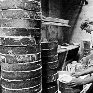 Workers at the Minton China Works in Stoke On Trent, set plates in "saggars"